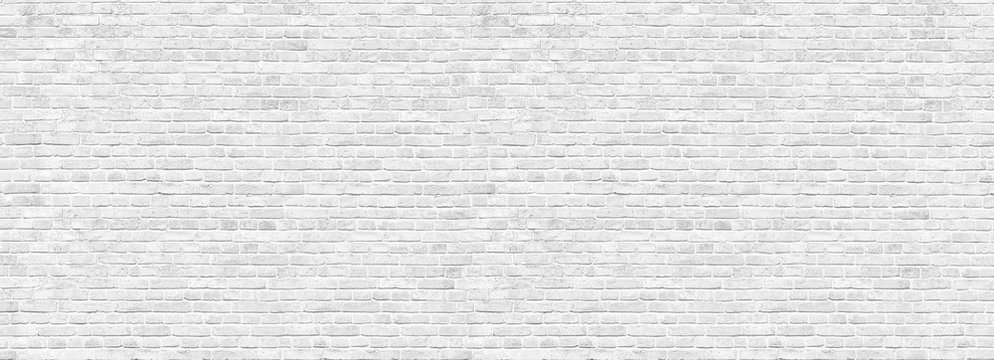 Old white brick wall background, wide panorama of masonry