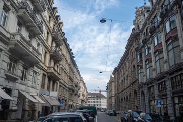 Beautiful scene of street and buildings in midtown of Zurich on blue sky with cloud background ,...