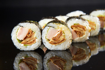 Traditional sushi roll with egg omelet and shred. Japanese food