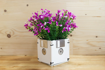 concept recycle floppy disk, flower in disk box, Creative objects used for obsolete furniture