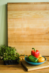 Colorful of Fresh Sweet Peppers on a Wooden Dish, Raw Organic Vegetable on a Table Ready to Cooking in The Kitchen Room.