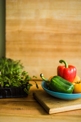 Colorful of Fresh Sweet Peppers on a Wooden Dish, Raw Organic Vegetable on a Table Ready to Cooking in The Kitchen Room.