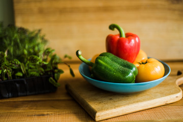 Colorful of Fresh Sweet Peppers on a Wooden Dish, Raw Organic Vegetable on a Table Ready to Cooking in The Kitchen Room.