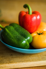 Colorful of Fresh Sweet Peppers on a Wooden Dish, Raw Organic Vegetable on a Table Ready to Cooking in The Kitchen Room.