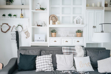 Home decor - Bright cosy comfy white living room with winter decorations for family or couple.
