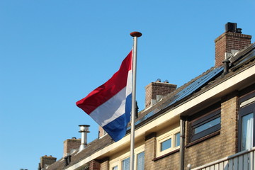 National flag of the Netherlands in red, white and blue on a pole in nieuwerkerk aan den IJssel