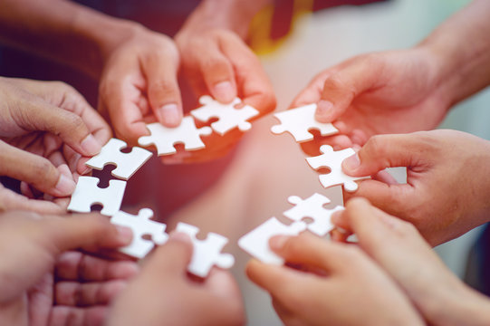 Team work, hands and jig Saw Unite with power Is a good team of successful people Team work concept