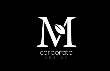 black and white M letter alphabet leaf logo icon design for company and business