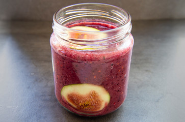 Breakfast acai superfoods smoothies bowl with fresh fig