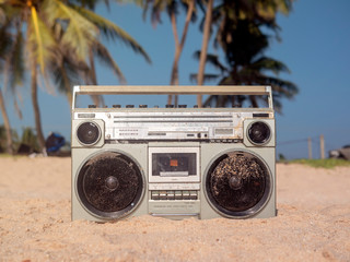 Tape recorder in sea foam and waves.
