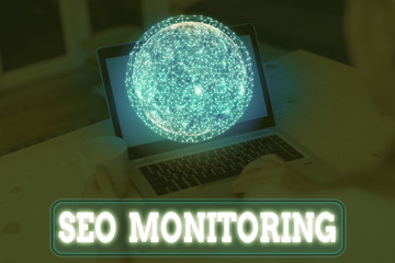 Writing note showing Seo Monitoring. Business concept for the process of optimizing the visibility...