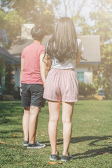 Fototapeta premium Soft Focus, couples who are choosing their favorite houses before entering into a house purchase agreement with the credit department The concept of buying a house for the stability of married life