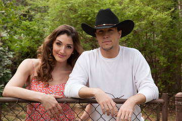 Happy Couple outdoors on a fence