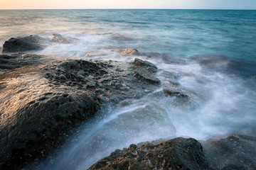 Waves and rocks shore long exposure