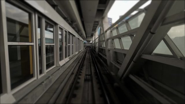 4k, Hyperlapse time-lapse of POV Journey on modern driverless Taipei elevated Rail Metro System, running alongside through tunnel over city. Rails transit automatic train view through the window-Dan
