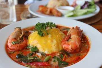 River prawn spicy soup,thai food called Tom Yum Kung with omelet