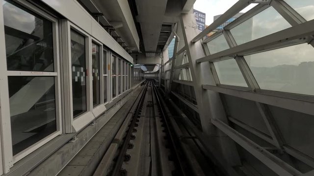 4k, Timelapse point of view of automatic train moving through Taipei tunnels via guideway transit system. Metro moving forward crossing capital city. Asia tourism, transport technology concept-Dan