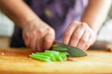 slicing red pepper on chopping board super slow motion