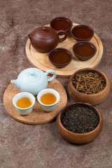 Obraz na płótnie Canvas Chinese tea sets on stone backrogrund. Top view