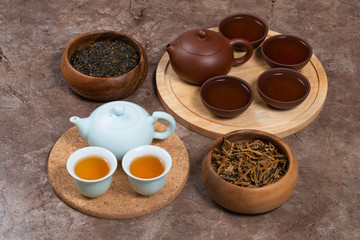 Chinese tea ceremony with porcelain tea set and clay tea set
