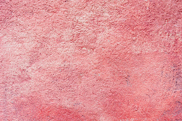 Fototapeta premium Old concrete cement wall painted in red