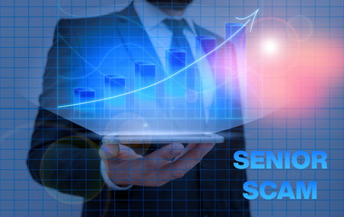 Writing note showing Senior Scam. Business concept for fraud schemes targeting the lifestyle and...