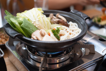 Japanese sukiyaki hot pot with vegetable, beef slice and udon noodles