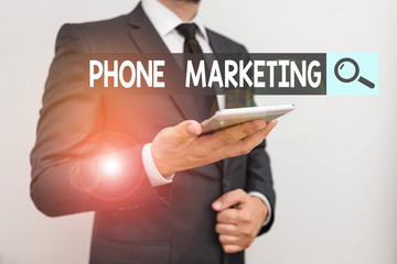 Text sign showing Phone Marketing. Business photo text art of promoting products and services via mobile devices Male human wear formal work suit hold smart hi tech smartphone use one hand