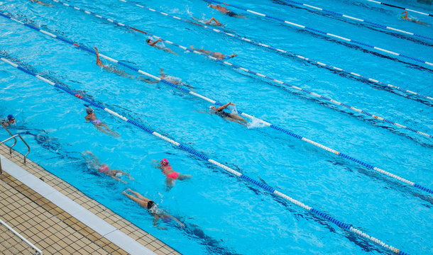 swimmers at the outdoor pool training