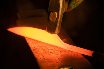 Forging a knife out of the metal