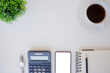 Top view white office desk table with the office equipments, computer keyboard and other office supplies on the modern space, flat lay.