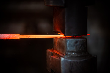 Forging a detail out of the hot red metal