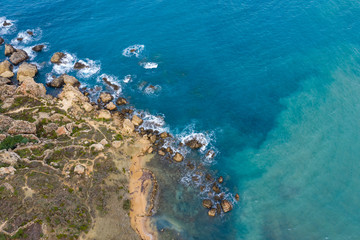Ghajn Tuffieha, Malta - Aerial panoramic view of the coast of Ghajn Tuffieha with Gnejna Bay, Riviera Bay and Golden Bay at sunrise