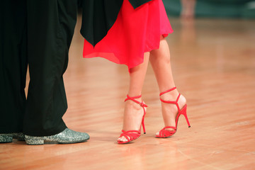 Beautiful woman in red dress dancing Argentinian tango 