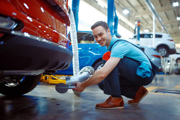 Worker connects the exhaust gas ventilation system