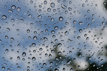 Raindrops on the window glass in the spring time