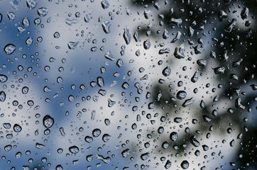 Raindrops on the window glass in the spring time