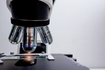 Cropped shot view of  the equipment and science experiments in Laboratory, Chemical substances for research and analyzing a sample under the microscope in laboratory. 