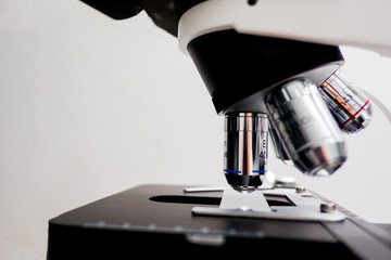 Cropped shot view of  the equipment and science experiments in Laboratory, Chemical substances for research and analyzing a sample under the microscope in laboratory. 