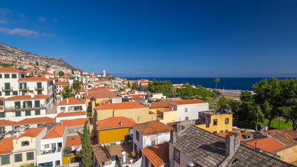 Naklejka na ściany i meble View from the mountain over the rooftops from cable car on Madeira timelapse hyperlapse.