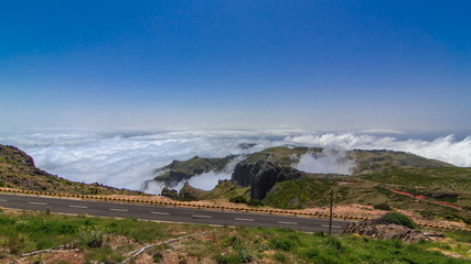Fototapeta na wymiar View down over the clouds from slopes of Pico do Arieiro, Madeira timelapse