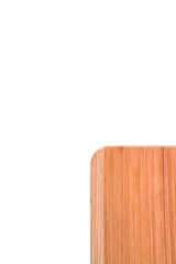 Top view on corner of a wooden cutting board
