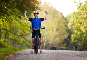 happy biker with raised hands