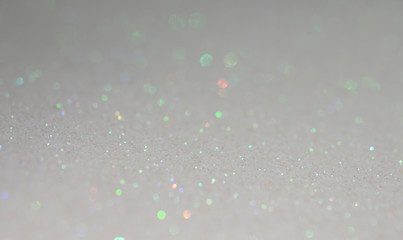 Sparkle of purple, orange, colorful on a grayish white background