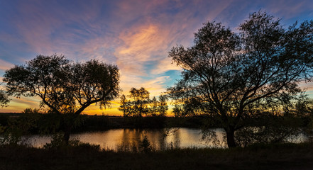 landscape of sunset with cloudy orange sky