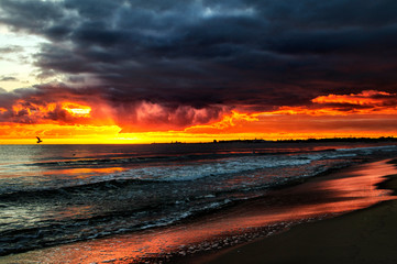 Fototapeta na wymiar Sunset by the sea, beach