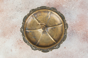 Antique brass serving dish with ring handle