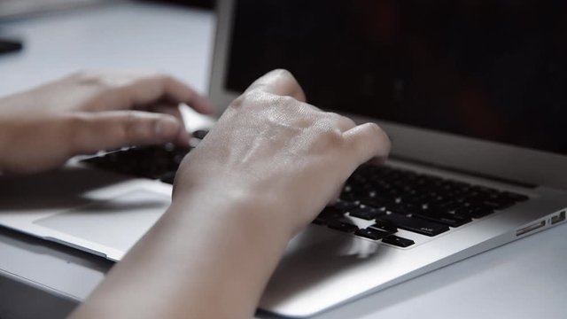 typing on laptop keyboard