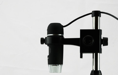 USB microscope, side view against white background
