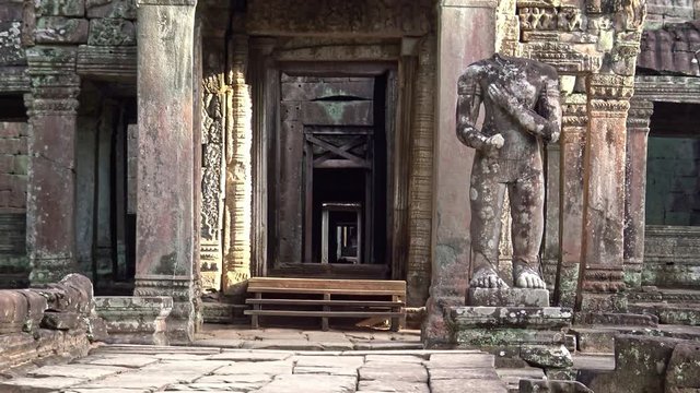 4K, Entrance door to Preah Khan temple. Gate with one guard sculpture. Ancient monument ruins in Angkor Thom Cambodia. Religious architecture landmarks buildings near Siem Reap. Khmer empire. -Dan